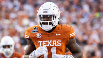 Dec 21, 2024; Austin, Texas, USA; Texas Longhorns linebacker Colin Simmons (11) against the Clemson Tigers during the CFP National playoff first round at Darrell K Royal-Texas Memorial Stadium. Mandatory Credit: Mark J. Rebilas-Imagn Images