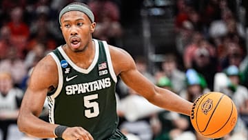 Michigan State guard Tre Holloman (5) looks to pass against Auburn during the first half of the Elite Eight round of NCAA tournament at State Farm Arena in Atlanta, Ga. on Sunday, March 30, 2025.
