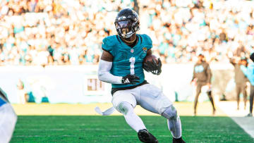 Dec 31, 2023; Jacksonville, Florida, USA; Jacksonville Jaguars running back Travis Etienne Jr. (1) runs the ball against Carolina at EverBank Stadium. Mandatory Credit: Jeremy Reper-USA TODAY Sports