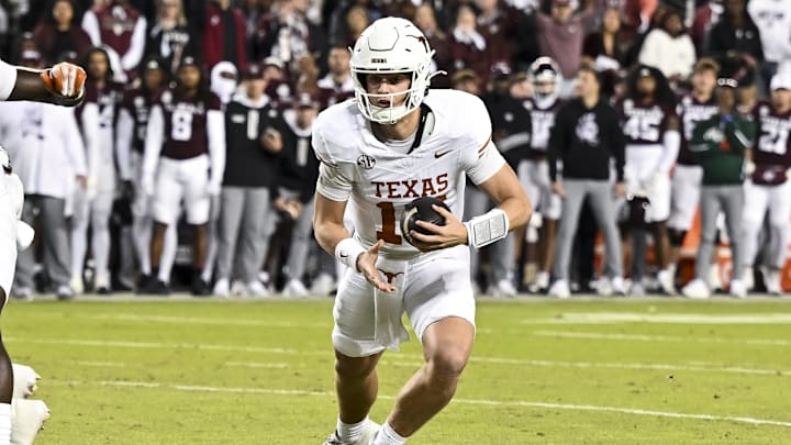 Nov 30, 2024; College Station, Texas, USA; Texas Longhorns quarterback Arch Manning (16) runs the ball during the first quarter against the Texas A&M Aggies.