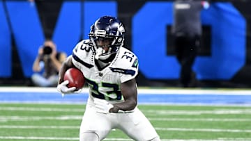 Sep 30, 2024; Detroit, Michigan, USA; Seattle Seahawks cornerback Dee Williams (33) runs the ball against the Detroit Lions in the first quarter at Ford Field. Mandatory Credit: Eamon Horwedel-Imagn Images