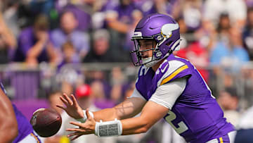 Aug 16, 2025; Minneapolis, Minnesota, USA; Minnesota Vikings quarterback Max Brosmer (12) receives the snap against the New England Patriots in the fourth quarter at U.S. Bank Stadium. Mandatory Credit: Brad Rempel-Imagn Images