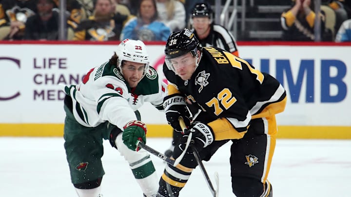 Oct 29, 2024; Pittsburgh, Pennsylvania, USA;  Pittsburgh Penguins left wing Anthony Beauvillier (72) moves the puck against pressure from Minnesota Wild center Marat Khusnutdinov (22) during the third period at PPG Paints Arena. Mandatory Credit: Charles LeClaire-Imagn Images