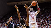 Indiana Hoosiers forward Mackenzie Mgbako (21) shoots the ball while South Carolina Gamecocks forward Collin Murray-Boyles (30) defends in the first half at Simon Skjodt Assembly Hall.