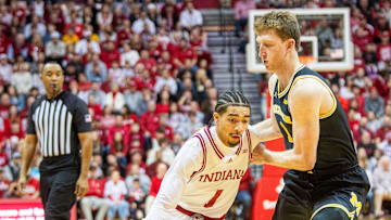 Indiana's Myles Rice (1) drives on Danny Wolf (1) during the Indiana versus Michigan mens basketball game at Simon Skjodt Assembly Hall on Saturday, Feb. 8, 2025.
