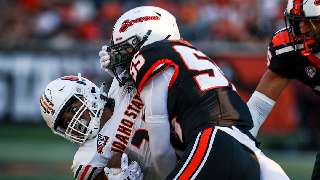 Oregon State Beavers linebacker Dexter Foster (55) takes down Idaho State Bengals running back Dason Brooks (28) during the second half. 