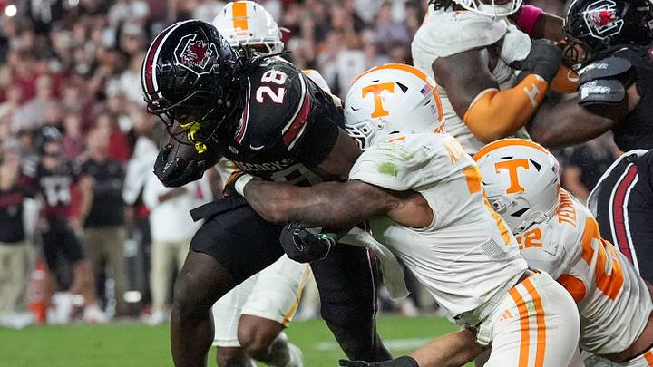 Oct 24, 2026; Columbia, South Carolina, USA;  South Carolina Gamecocks running back Matt Fuller (28) is gang tackled by the Tennessee Volunteers defense during the second half at Williams-Brice Stadium.  Mandatory Credit: Jim Dedmon-Imagn Images