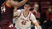 Jan 8, 2025; Stanford, California, USA; Stanford Cardinal forward Maxime Raynaud (42) tries to back down Virginia Tech Hokies forward Mylyjael Poteat (34) during the second half at Maples Pavilion. Mandatory Credit: D. Ross Cameron-Imagn Images