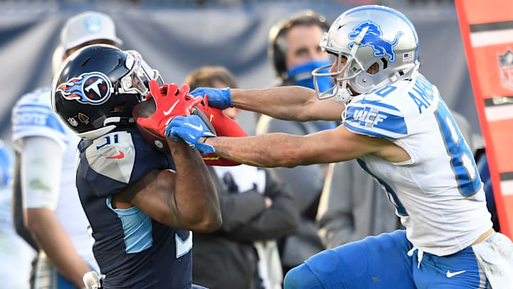 Tennessee Titans free safety Kevin Byard (31) pulls in an interception over Detroit Lions wide receiver Danny Amendola (80),