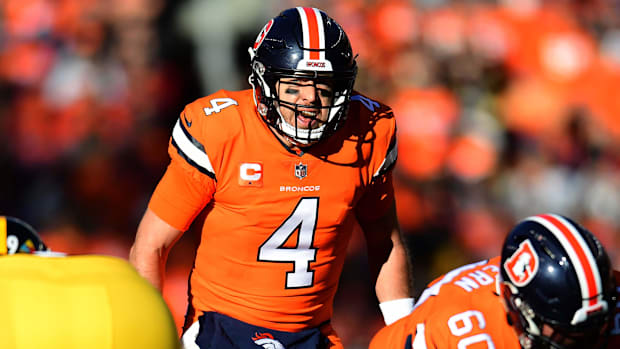 Denver Broncos quarterback Case Keenum (4) calls out in the first quarter against the Pittsburgh Steelers at Broncos Stadium.