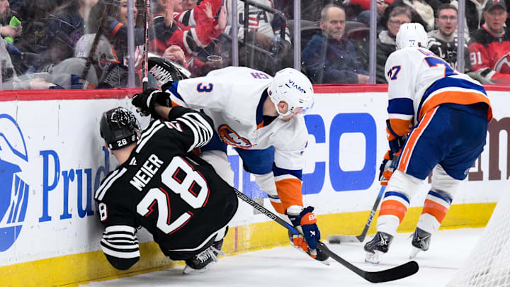 New York Islanders defenseman Adam Pelech (3) checks New Jersey Devils right wing Timo Meier (28): John Jones-Imagn Images