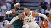 Jul 30, 2024; Villeneuve-d'Ascq, France; Canada small forward Dillon Brooks (24) posts up against Australia guard Patty Mills (5) in a men's group stage basketball match during the Paris 2024 Olympic Summer Games at Stade Pierre-Mauroy. Mandatory Credit: John David Mercer-USA TODAY Sports
