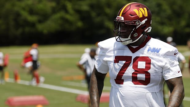 Washington Commanders offensive tackle Laremy Tunsil (78) stands on the field on day one of minicamp at Commanders Park.