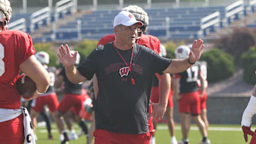 Wisconsin offensive line coach Jack Bicknell Jr. talks with his players during practice on Sunday Aug. 6, 2023 at Pioneer Stadium in Platteville, Wis.