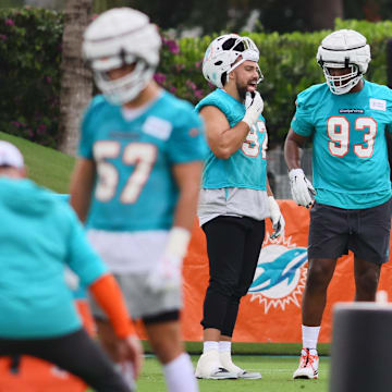 Miami Dolphins defensive tackle Zach Sieler (92) talks to defensive tackle Calais Campbell (93) during training camp at Baptist Health Training Complex.