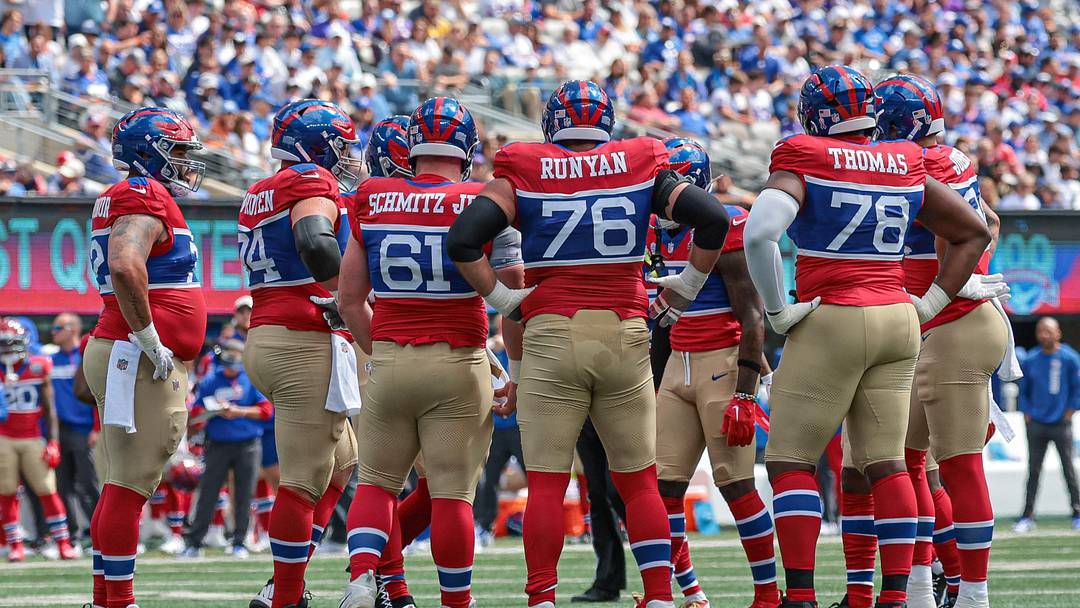 Sep 8, 2024; East Rutherford, New Jersey, USA; New York Giants offensive linemen huddle during the first quarter against the Minnesota Vikings at MetLife Stadium.  