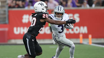 Nov 2, 2024; Houston, Texas, USA; Kansas State Wildcats running back Dylan Edwards (3) is tackled by Houston Cougars defensive back Jeremiah Wilson (20) in the first quarter at TDECU Stadium. Mandatory Credit: Thomas B. Shea-Imagn Images