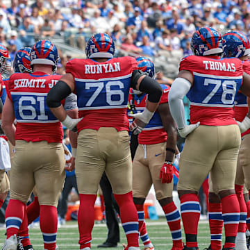  New York Giants offensive linemen huddle during the first quarter against the Minnesota Vikings at MetLife Stadium.  