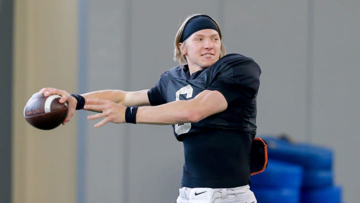 Zane Flores (6) runs drills during an Oklahoma State football practice