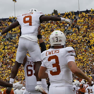 Sep 7, 2024; Ann Arbor, Michigan, USA; Texas Longhorns running back Jerrick Gibson (9) celebrates after scoring in the first half against the Michigan Wolverines at Michigan Stadium. Mandatory Credit: Rick Osentoski-Imagn Images