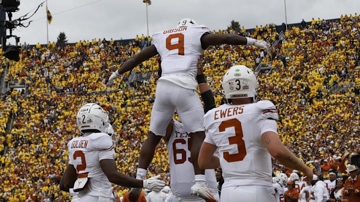 Sep 7, 2024; Ann Arbor, Michigan, USA; Texas Longhorns running back Jerrick Gibson (9) celebrates after scoring in the first half against the Michigan Wolverines at Michigan Stadium. Mandatory Credit: Rick Osentoski-Imagn Images