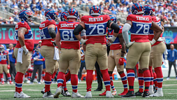 Sep 8, 2024; East Rutherford, New Jersey, USA; New York Giants offensive linemen huddle during the first quarter against the Minnesota Vikings at MetLife Stadium. Mandatory Credit: Vincent Carchietta-Imagn Images