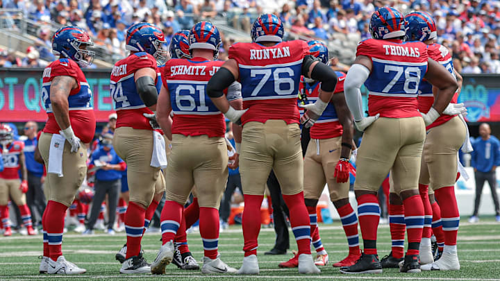 Sep 8, 2024; East Rutherford, New Jersey, USA; New York Giants offensive linemen huddle during the first quarter against the Minnesota Vikings at MetLife Stadium.  