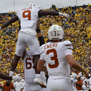 Sep 7, 2024; Ann Arbor, Michigan, USA; Texas Longhorns running back Jerrick Gibson (9) celebrates after scoring in the first half against the Michigan Wolverines at Michigan Stadium. 