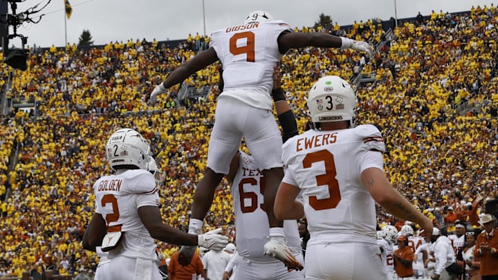 Sep 7, 2024; Ann Arbor, Michigan, USA; Texas Longhorns running back Jerrick Gibson (9) celebrates after scoring in the first half against the Michigan Wolverines at Michigan Stadium. 