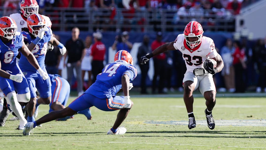 Nov 1, 2025; Jacksonville, Florida, USA; Georgia Bulldogs running back Chauncey Bowens (33) runs the ball in the second quarter against the Florida Gators at EverBank Stadium. Nov 1, 2025; Jacksonville, Florida, USA; Georgia Bulldogs running back Chauncey Bowens (33) runs the ball in the second quarter against the Florida Gators at EverBank Stadium.