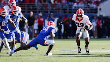 Nov 1, 2025; Jacksonville, Florida, USA; Georgia Bulldogs running back Chauncey Bowens (33) runs the ball in the second quarter against the Florida Gators at EverBank Stadium. 