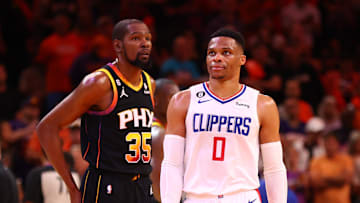 Apr 25, 2023; Phoenix, Arizona, USA; Los Angeles Clippers guard Russell Westbrook (0) against Phoenix Suns forward Kevin Durant (35) during game five of the 2023 NBA playoffs at Footprint Center. Mandatory Credit: Mark J. Rebilas-Imagn Images