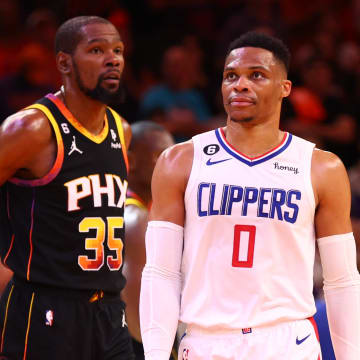 Apr 25, 2023; Phoenix, Arizona, USA; Los Angeles Clippers guard Russell Westbrook (0) against Phoenix Suns forward Kevin Durant (35) during game five of the 2023 NBA playoffs at Footprint Center. Mandatory Credit: