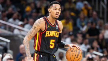 Apr 14, 2024; Indianapolis, Indiana, USA; Atlanta Hawks guard Dejounte Murray (5) dribbles the ball while Indiana Pacers guard Ben Sheppard (26) defends in the second half at Gainbridge Fieldhouse.