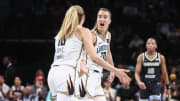 May 23, 2024; Brooklyn, New York, USA;  New York Liberty guard Sabrina Ionescu (20) celebrates with guard Ivana Dojkic (18) at the end of the first quarter against the Chicago Sky at Barclays Center.