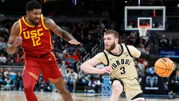 USC Trojans forward Rashaun Agee (12) defends Purdue Boilermakers guard Braden Smith (3) Thursday, March 13, 2025, during the