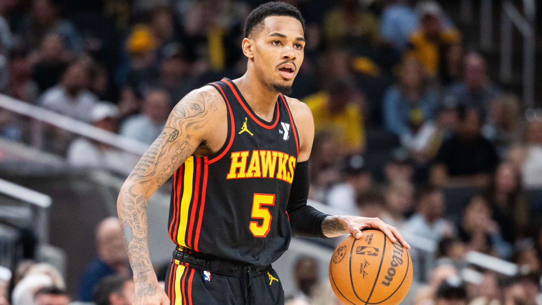 Apr 14, 2024; Indianapolis, Indiana, USA; Atlanta Hawks guard Dejounte Murray (5) dribbles the ball while Indiana Pacers guard Ben Sheppard (26) defends in the second half at Gainbridge Fieldhouse