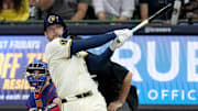 Milwaukee Brewers first baseman Rhys Hoskins (12) hits a grand slam home run during the sixth inning of their game against the Texas Rangers Monday, June 24, 2024 at American Family Field in Milwaukee, Wisconsin.