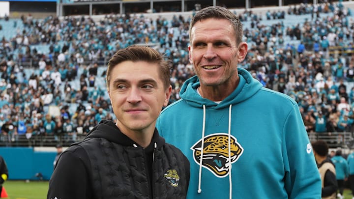 Jan 4, 2026; Jacksonville, Florida, USA; Jacksonville Jaguars general manager James Gladstone (left) and executive vice president of football operations Tony Boselli stand on the field after the game against the Tennessee Titans at EverBank Stadium. 