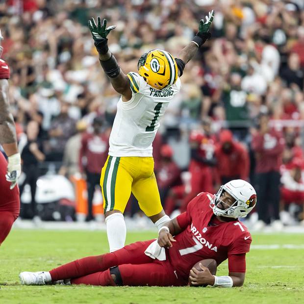 Arizona Cardinals quarterback Jacoby Brissett is sacked by Green Bay Packers defensive lineman Micah Parsons