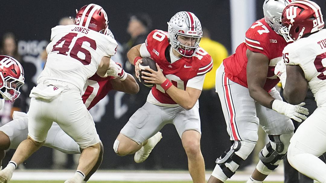 Ohio State Buckeyes quarterback Julian Sayin (10) scrambles during the first half of the Big Ten Conference championship game against the Indiana Hoosiers at Lucas Oil Stadium in Indianapolis on Dec. 6, 2025.