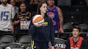 Jul 22, 2025; Brooklyn, New York, USA;  Indiana Fever guard Caitlin Clark (22) walks onto the court prior to the game against the New York Liberty at Barclays Center. Mandatory Credit: Wendell Cruz-Imagn Images