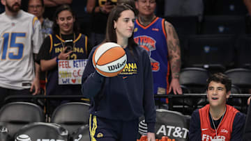 Jul 22, 2025; Brooklyn, New York, USA;  Indiana Fever guard Caitlin Clark (22) walks onto the court prior to the game against the New York Liberty at Barclays Center. Mandatory Credit: Wendell Cruz-Imagn Images