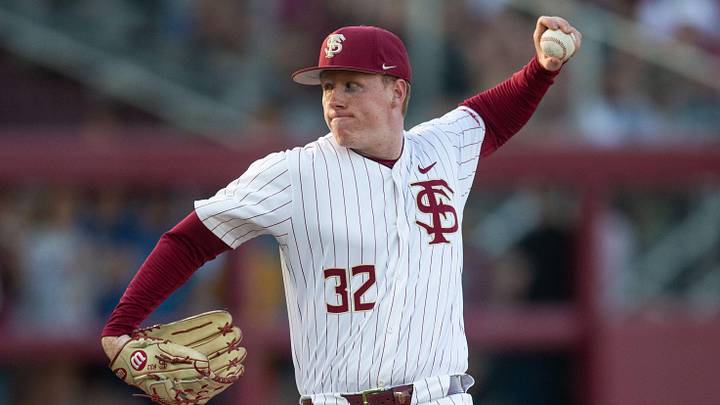 Florida State Seminoles pitcher Cooper Whited (32) winds up to pitch. The Florida State Seminoles hosted the Florida Gators at Dick Howser Stadium on Tuesday, April 7, 2026.