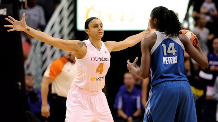 Sep. 21, 2012; Phoenix, AZ, USA; Phoenix Mercury forward Candice Dupree (4) guards the Minnesota Lynx forward Devereaux Peters (14) in the first half at US Airways Center. Mandatory Credit: Jennifer Stewart-Imagn Images
