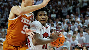 Razorback freshman guard Karter Knox (11) goes to the basket against Kadin Shedrick in Wednesdays win over the Texas Longhorns at Bud Walton Arena. 