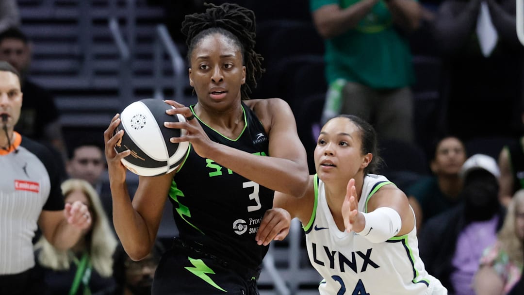 Jun 11, 2025; Seattle, Washington, USA; Seattle Storm forward Nneka Ogwumike (3) looks to pass with Minnesota Lynx forward Napheesa Collier (24) defending during the second half at Climate Pledge Arena. Mandatory Credit: John Froschauer-Imagn Images