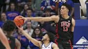 Feb 19, 2023; Boise, Idaho, USA; Boise State Broncos guard Marcus Shaver Jr. (10) has shot blocked by UNLV Rebels center David Muoka (12) during the first half at ExtraMile Arena. Mandatory Credit: Brian Losness-Imagn Images

