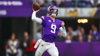 J.J. McCarthy throws a pass against the Commanders in Week 14.