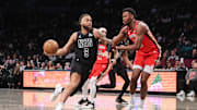 Apr 8, 2025; Brooklyn, New York, USA;  Brooklyn Nets forward Trendon Watford (9) looks to drive past New Orleans Pelicans center Yves Missi (21) in the first quarter at Barclays Center. Mandatory Credit: Wendell Cruz-Imagn Images